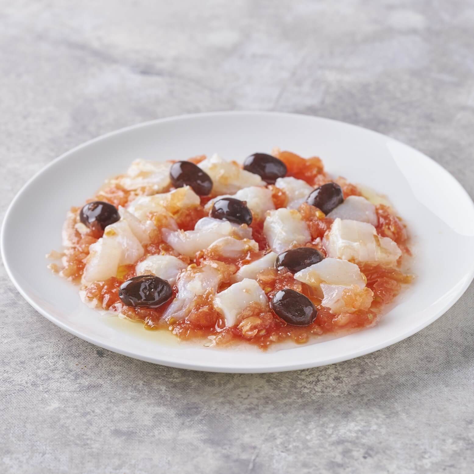 Esqueixada de bacalao con tomate rallado, aceitunas y aceite de oliva – Prepared Appetizers & Side Dishes | Bacalalo gourmet