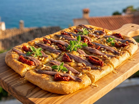 Coca de anchoas y tomate seco