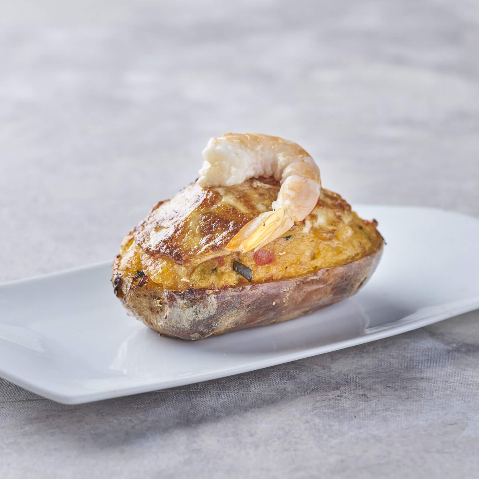 Patatas rellenas de bacalao y sanfaina gratinadas con queso – Prepared Meals & Entrées | Bacalalo gourmet